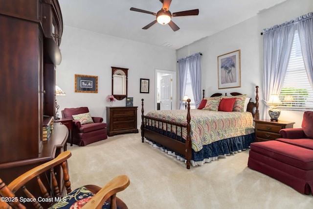 bedroom featuring a ceiling fan and carpet