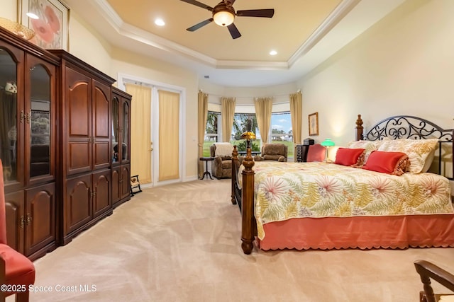 bedroom with baseboards, crown molding, a tray ceiling, recessed lighting, and light colored carpet