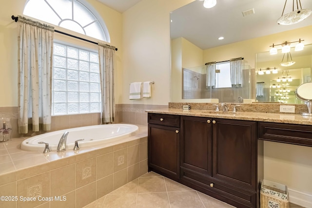full bath featuring visible vents, walk in shower, vanity, tile patterned floors, and a garden tub
