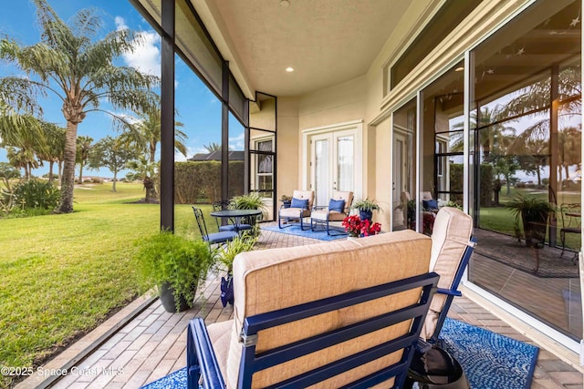 sunroom with french doors and an outdoor hangout area