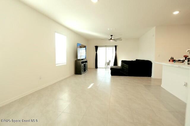 1217 Casey Ave, Rockledge, FL 32955 - living area with recessed lighting, a ceiling fan, baseboards, and light tile patterned flooring