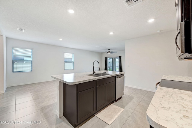 1217 Casey Ave, Rockledge, FL 32955 - kitchen featuring stainless steel appliances, light countertops, healthy amount of natural light, a kitchen island with sink, and recessed lighting