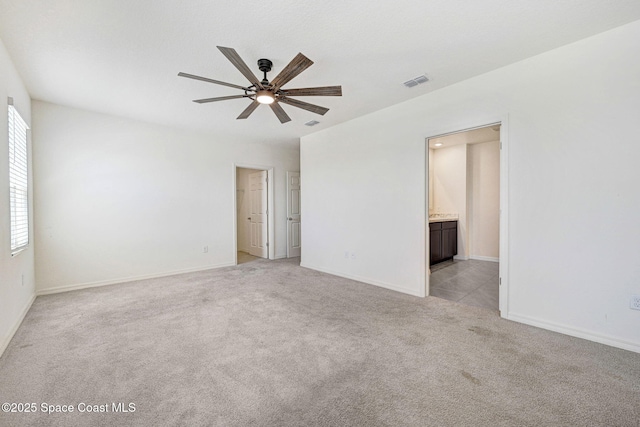 1217 Casey Ave, Rockledge, FL 32955 - unfurnished room with a ceiling fan, healthy amount of natural light, and light colored carpet