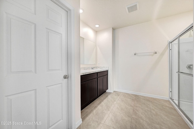1217 Casey Ave, Rockledge, FL 32955 - full bath featuring vanity, a shower stall, tile patterned flooring, and recessed lighting