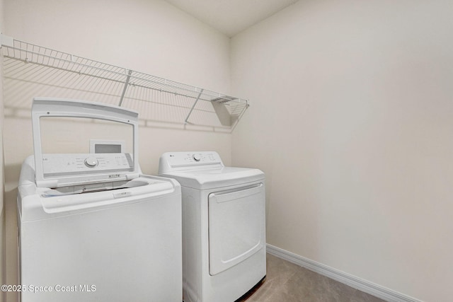 1217 Casey Ave, Rockledge, FL 32955 - laundry area with washer and dryer and baseboards