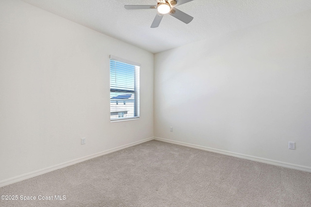 1217 Casey Ave, Rockledge, FL 32955 - empty room featuring a ceiling fan, light carpet, and a textured ceiling