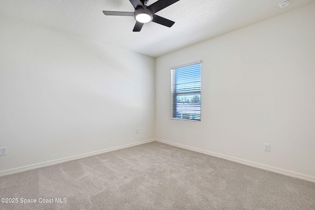 1217 Casey Ave, Rockledge, FL 32955 - spare room with a ceiling fan, light carpet, a textured ceiling, and a smoke detector