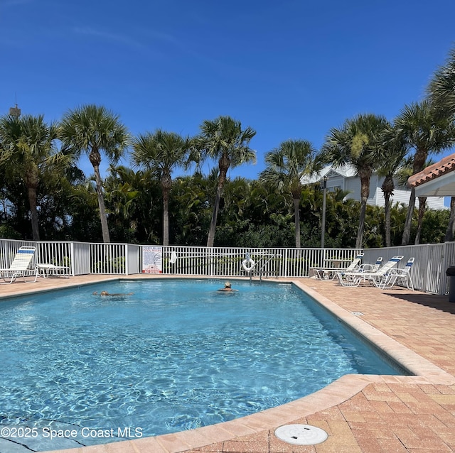 8903 Laguna Ln Unit 403, Cape Canaveral, FL 32920 - community pool with fence and a patio