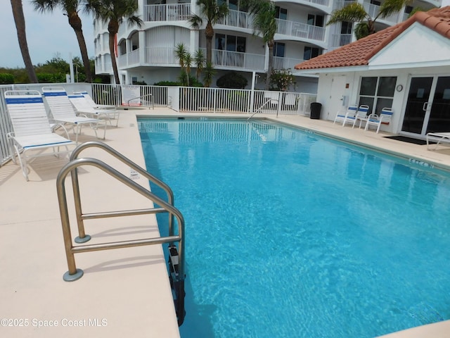 8903 Laguna Ln Unit 403, Cape Canaveral, FL 32920 - community pool featuring fence and a patio