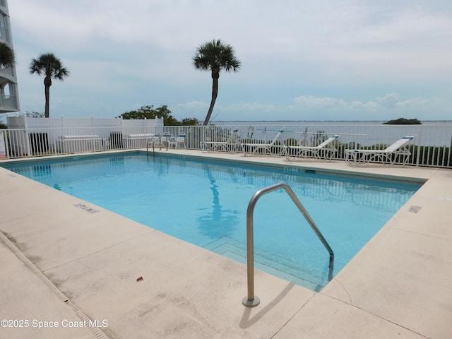 8903 Laguna Ln Unit 403, Cape Canaveral, FL 32920 - community pool featuring fence and a patio