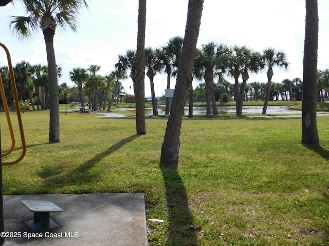 8903 Laguna Ln Unit 403, Cape Canaveral, FL 32920 - view of property's community featuring a water view and a lawn