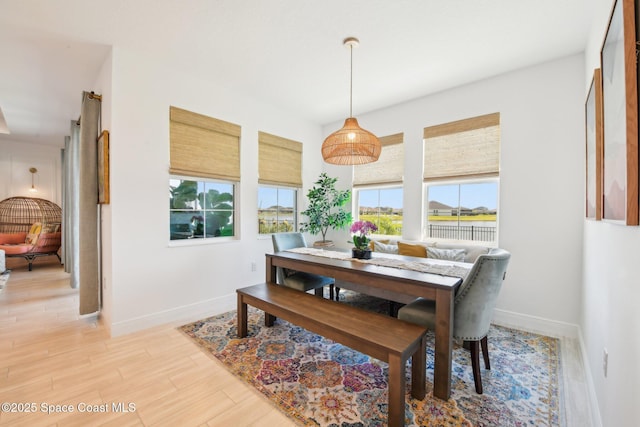 2257 Kamin Dr, Melbourne, FL 32940 - dining space with light wood-style flooring and baseboards