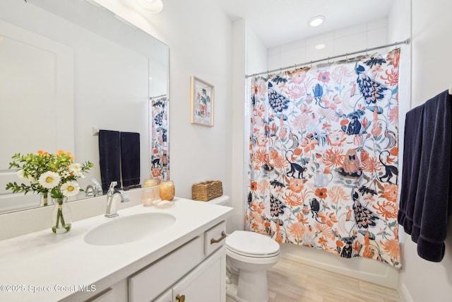 2257 Kamin Dr, Melbourne, FL 32940 - full bathroom featuring toilet, shower / bath combo, wood finished floors, and vanity