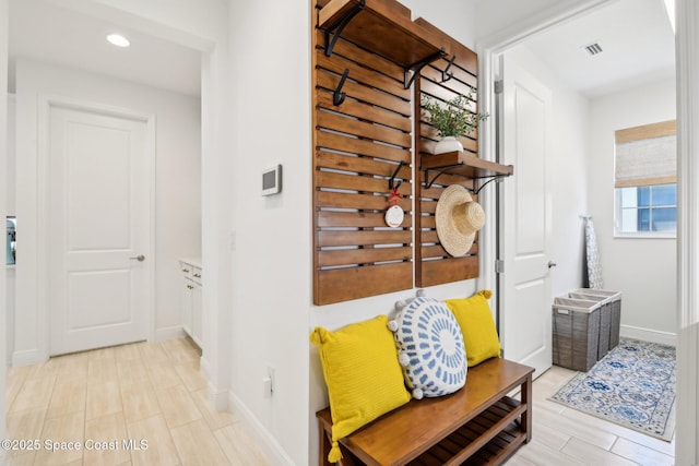 2257 Kamin Dr, Melbourne, FL 32940 - hallway featuring visible vents, baseboards, and recessed lighting