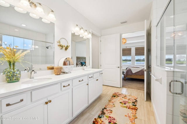 2257 Kamin Dr, Melbourne, FL 32940 - full bathroom featuring a sink, ensuite bathroom, plenty of natural light, and a stall shower