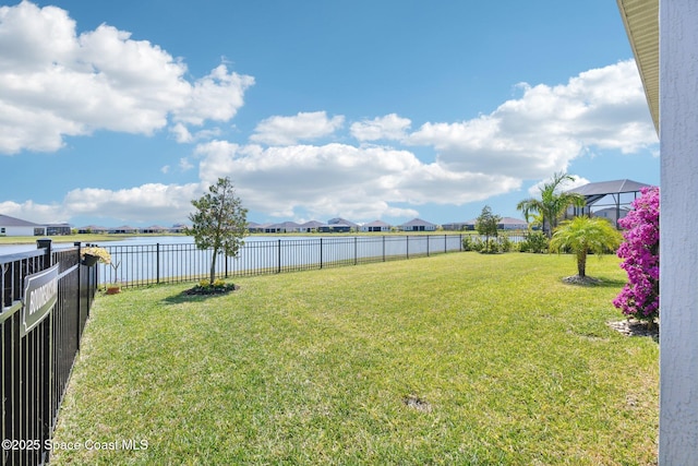 2257 Kamin Dr, Melbourne, FL 32940 - view of yard featuring a fenced backyard, a residential view, and a water view