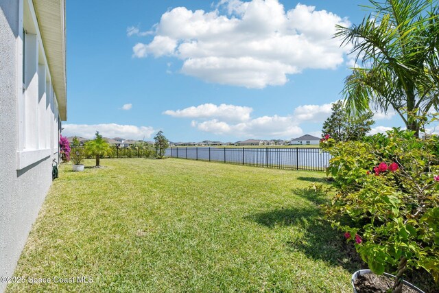 2257 Kamin Dr, Melbourne, FL 32940 - view of yard with a water view and a fenced backyard
