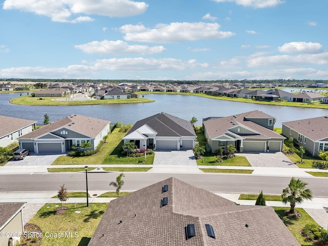 2257 Kamin Dr, Melbourne, FL 32940 - drone / aerial view with a water view and a residential view