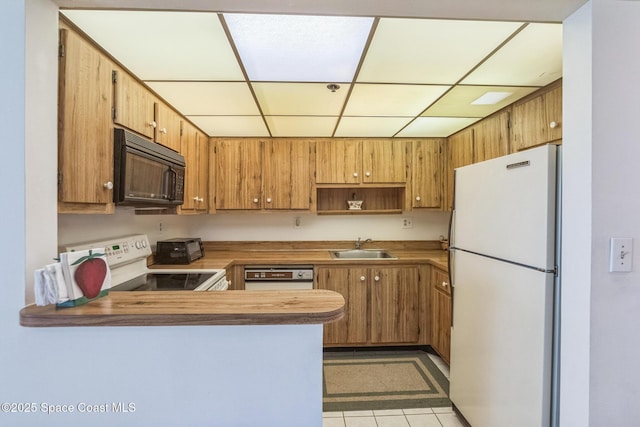 kitchen with open shelves, a sink, a paneled ceiling, white appliances, and a peninsula