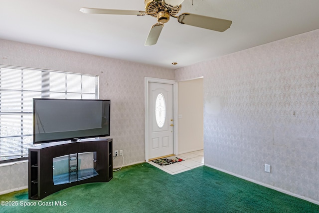 2180 Lakeview Dr, Melbourne, FL 32935 - foyer with a healthy amount of sunlight, a ceiling fan, and carpet