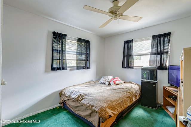 2180 Lakeview Dr, Melbourne, FL 32935 - carpeted bedroom featuring ceiling fan and baseboards