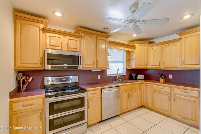 2180 Lakeview Dr, Melbourne, FL 32935 - kitchen featuring appliances with stainless steel finishes, light brown cabinetry, and a sink