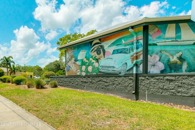 2180 Lakeview Dr, Melbourne, FL 32935 - view of side of home with a lawn