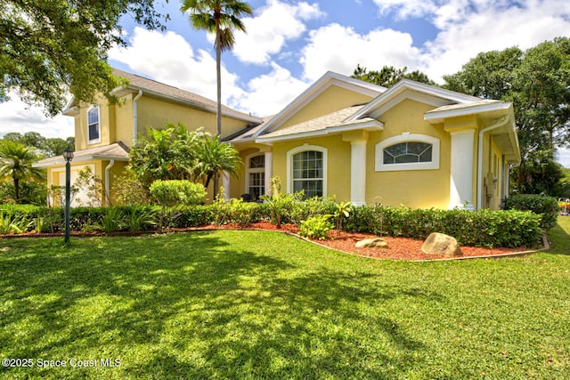 1772 Windbrook Dr SE, Palm Bay, FL 32909 - view of front of property with a front lawn and stucco siding
