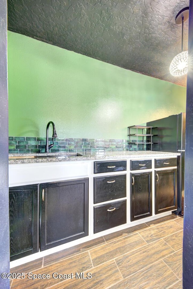 1772 Windbrook Dr SE, Palm Bay, FL 32909 - bar featuring hanging light fixtures and a sink