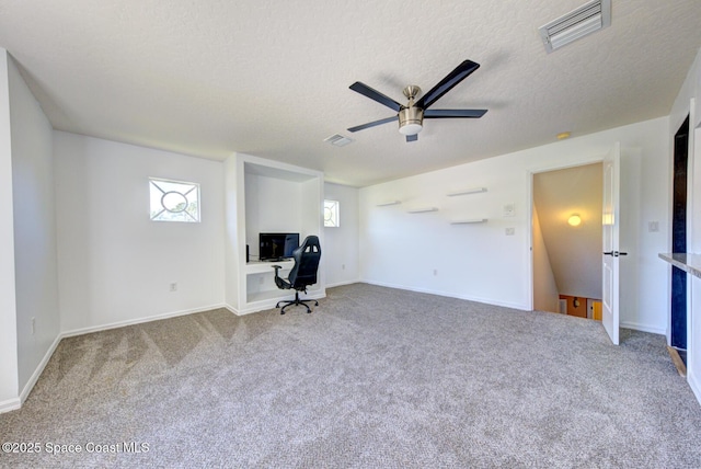 1772 Windbrook Dr SE, Palm Bay, FL 32909 - unfurnished office featuring carpet flooring, visible vents, a textured ceiling, and ceiling fan
