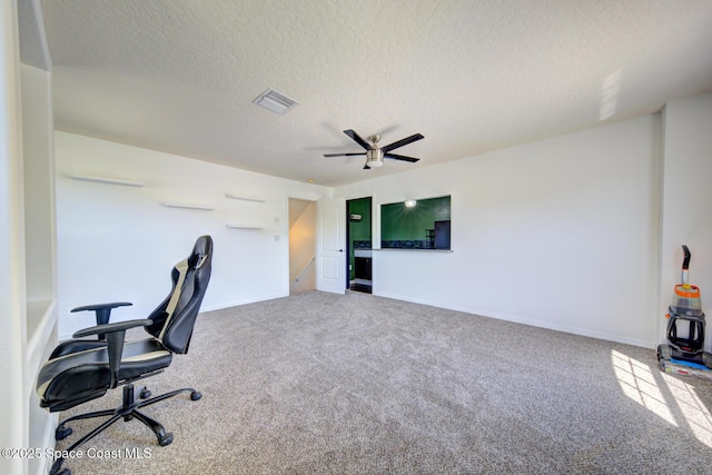 1772 Windbrook Dr SE, Palm Bay, FL 32909 - carpeted home office with a textured ceiling, a ceiling fan, baseboards, and visible vents