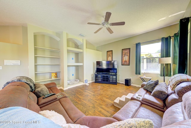 1772 Windbrook Dr SE, Palm Bay, FL 32909 - living room with a textured ceiling, wood finished floors, visible vents, and baseboards