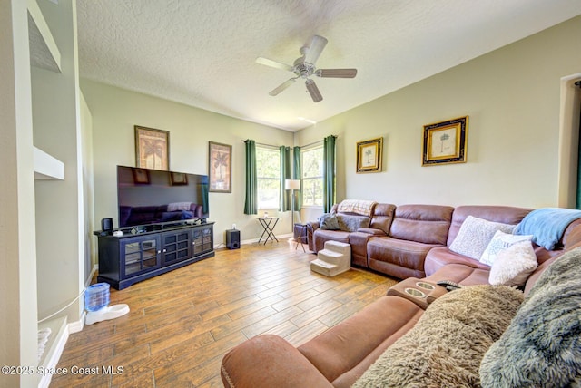 1772 Windbrook Dr SE, Palm Bay, FL 32909 - living area with baseboards, a ceiling fan, wood finished floors, and a textured ceiling