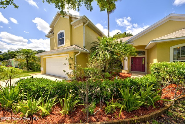 1772 Windbrook Dr SE, Palm Bay, FL 32909 - mediterranean / spanish-style house featuring stucco siding and an attached garage