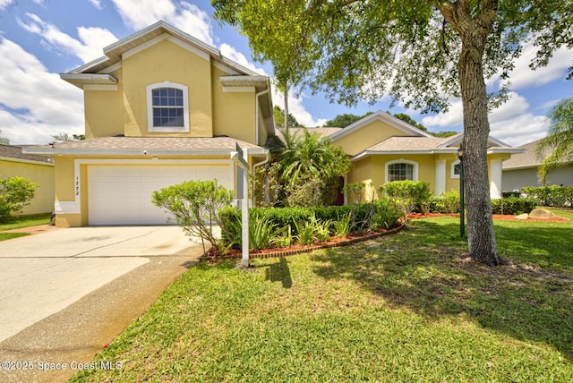 1772 Windbrook Dr SE, Palm Bay, FL 32909 - view of front of home featuring stucco siding, a front lawn, concrete driveway, and a garage