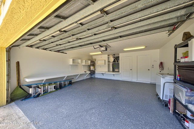1772 Windbrook Dr SE, Palm Bay, FL 32909 - garage with water heater and a garage door opener