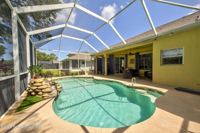 1772 Windbrook Dr SE, Palm Bay, FL 32909 - outdoor pool with glass enclosure, an outdoor hangout area, a patio area, and a ceiling fan