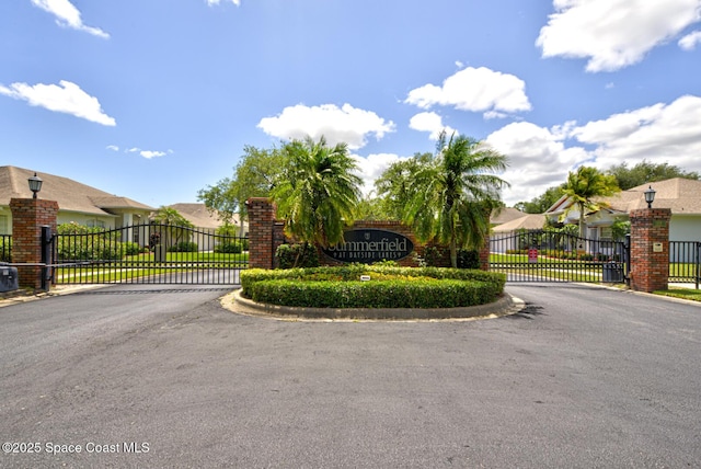 1772 Windbrook Dr SE, Palm Bay, FL 32909 - community / neighborhood sign featuring a gate and a residential view