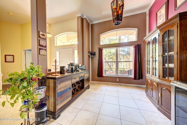 1772 Windbrook Dr SE, Palm Bay, FL 32909 - entryway featuring a towering ceiling, baseboards, and light tile patterned floors