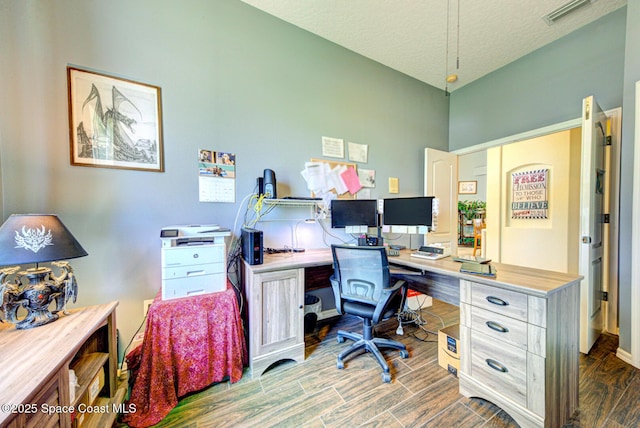 1772 Windbrook Dr SE, Palm Bay, FL 32909 - office space with baseboards, wood finished floors, visible vents, and a textured ceiling