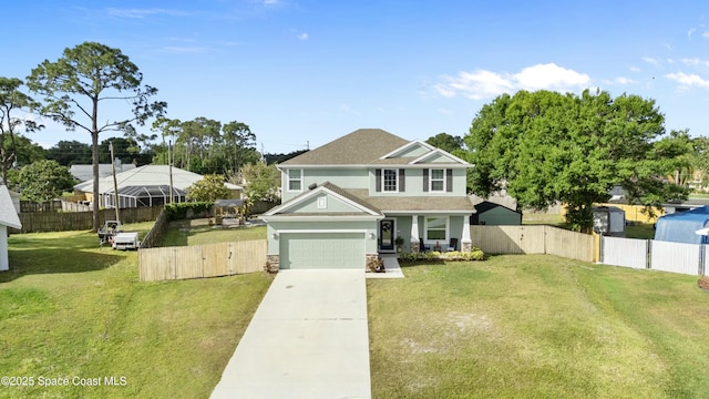 view of front of house with a front lawn, fence, a gate, and driveway
