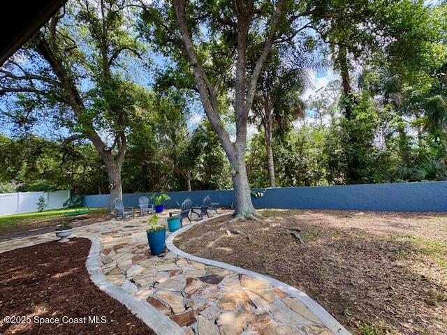 572 Lake Ashley Cir, Melbourne, FL 32904 - view of yard featuring fence