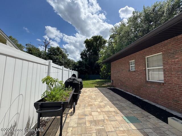 572 Lake Ashley Cir, Melbourne, FL 32904 - view of patio with fence