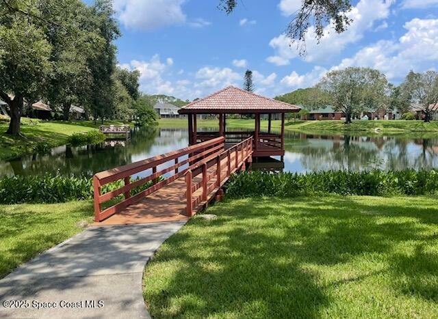 572 Lake Ashley Cir, Melbourne, FL 32904 - dock area featuring a gazebo, a water view, and a lawn