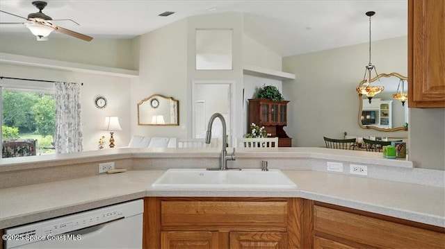 kitchen with dishwasher, light countertops, a sink, and a ceiling fan