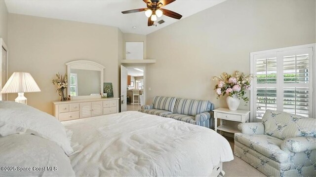 bedroom featuring high vaulted ceiling, ceiling fan, and visible vents