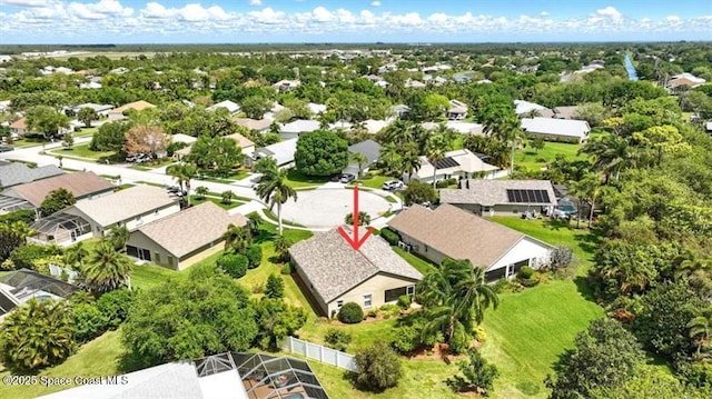 birds eye view of property with a residential view