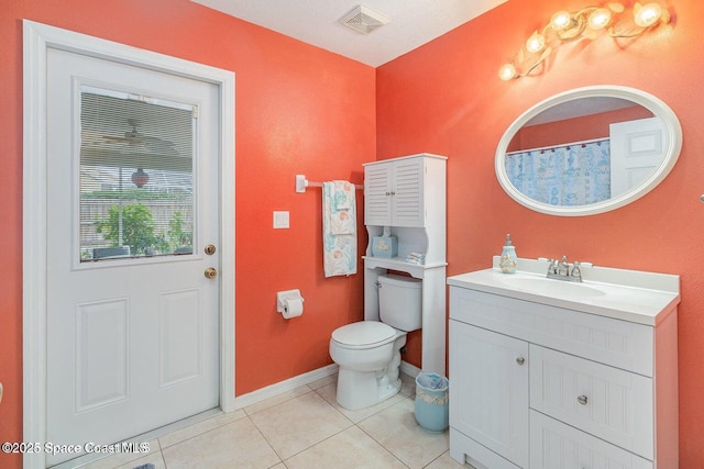 6109 Meghan Dr, Melbourne, FL 32940 - full bathroom with baseboards, toilet, tile patterned floors, and vanity