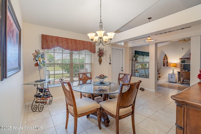 6109 Meghan Dr, Melbourne, FL 32940 - dining space with a chandelier, light tile patterned floors, baseboards, and lofted ceiling