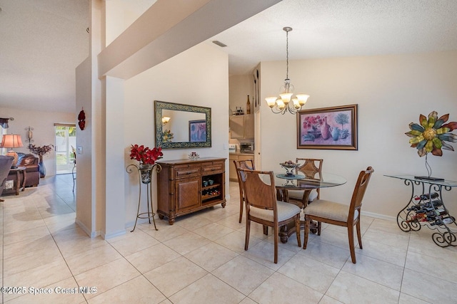 6109 Meghan Dr, Melbourne, FL 32940 - dining area with a chandelier, light tile patterned floors, lofted ceiling, and baseboards